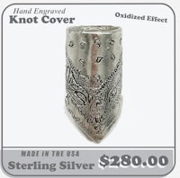 a silver bandana with the words hand engraved knot cover